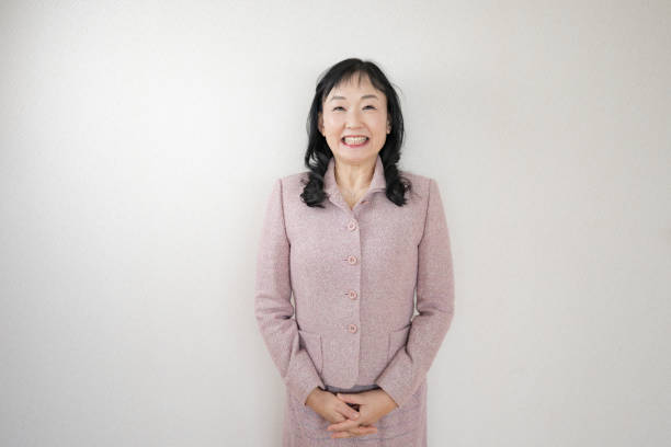 istock Smile woman pink suit 2076740429