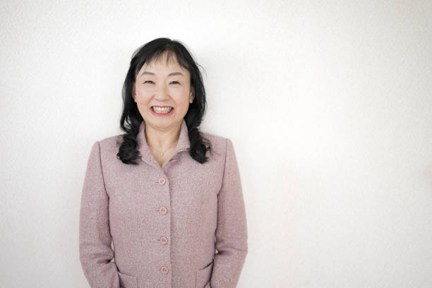 istock Smile woman pink suit 2076740783