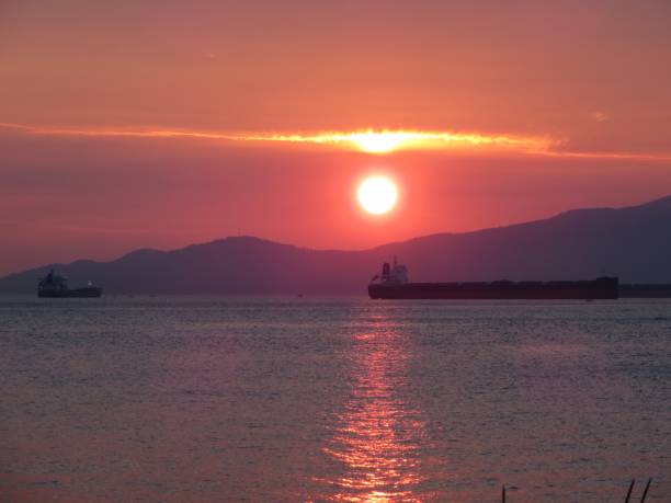 istock Cargo Ship at Sunset in Vancouver Canada 2076759816