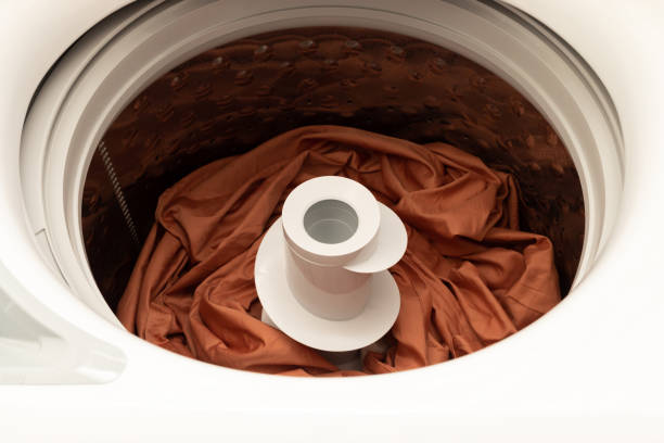 istock Top Loading Washing Machine With Colorful Bed Linen Inside. Laundry. Taking Care Of Colored Fabric, Apparel. Horizontal Plane 2076801636