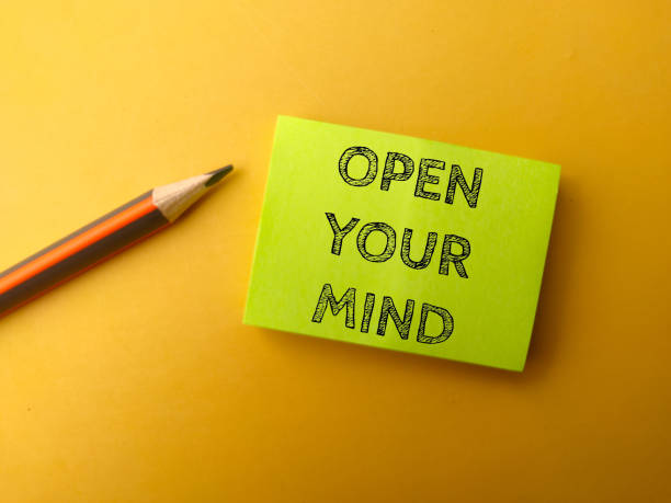 istock Sticky note and pencil with the word OPEN YOUR MIND 2076808968
