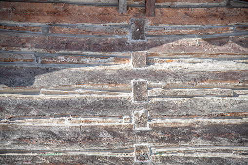 brown rustic wooden texture background. facade of a log house, copy space