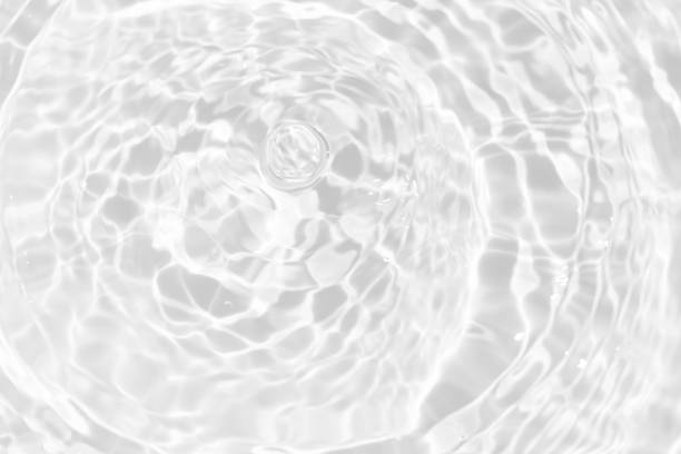 istock White water surface texture with ripples, splashes, and bubbles. Abstract summer banner background Water waves in sunlight with copy space cosmetic moisturizer micellar toner emulsion. White water. 2076905429