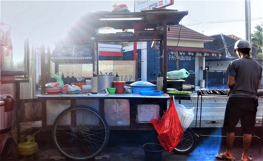 On the busy streets of Kuta, this vendor sell his treat on home-made stalls such as this one. Sampling on locally prepared food is a cultural connection making the travel experience more complete in an inexpensive way.
