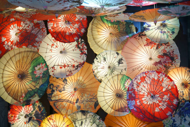 istock colorful paper umbrella background 2076923098
