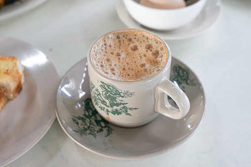 Popular drink in Malaysia called Teh Tarik. It is a sweet drink made from tea with milk.