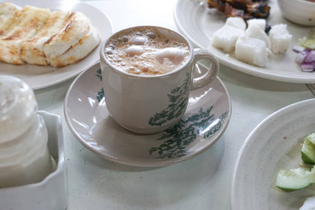 Breakfast set Breakfast set in Malaysia consisting of teh tarik, toast bread and half-boiled egg. kopitiam egg stock pictures, royalty-free photos & images