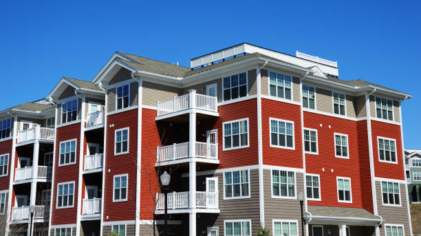 istock colorful apartment buildings and green front lawn in spring 2076932481