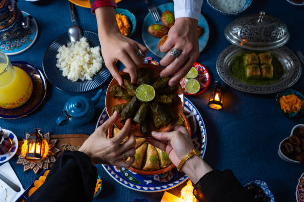 istock Ramadan Iftar Table. Muslim Family Having Dinner At Home. Iftar Table with Traditional Food. Fasting ends with Dates and Turkish Pide. Ramadan Feast Celebrations, Eid Mubarak Concept Uskudar Istanbul, Turkiye (Turkey) 2077050044