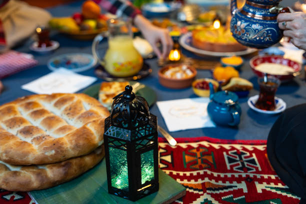 istock Ramadan Iftar Table. Muslim Family Having Dinner At Home. Iftar Table with Traditional Food. Fasting ends with Dates and Turkish Pide. Ramadan Feast Celebrations, Eid Mubarak Concept Uskudar Istanbul, Turkiye (Turkey) 2077052620