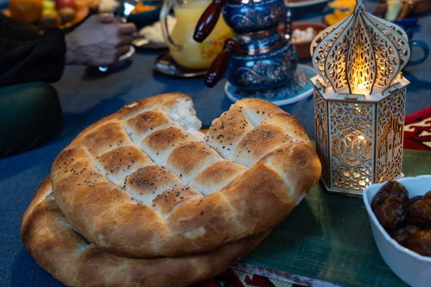 istock Ramadan Iftar Table. Muslim Family Having Dinner At Home. Iftar Table with Traditional Food. Fasting ends with Dates and Turkish Pide. Ramadan Feast Celebrations, Eid Mubarak Concept Uskudar Istanbul, Turkiye (Turkey) 2077060348