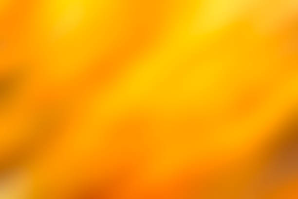 istock A yellow background with a blurry orange line 2077082599