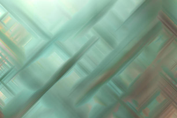 A blurry image of a green background with a few lines. The image has a sense of movement and energy, as if it's in motion. The lines seem to be overlapping and interweaving, creating a sense of depth