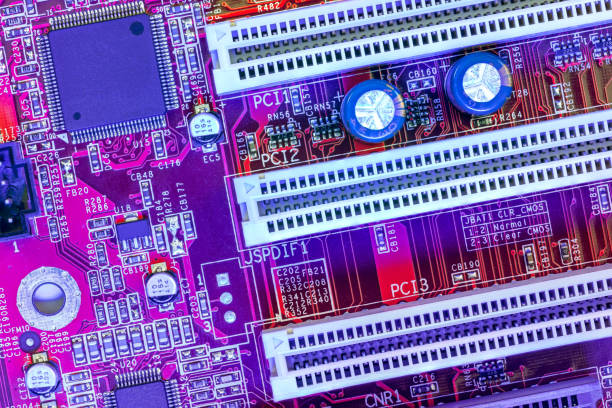 istock computer main board with sockets and chips. high-detailed view in blue red color. 2077248559