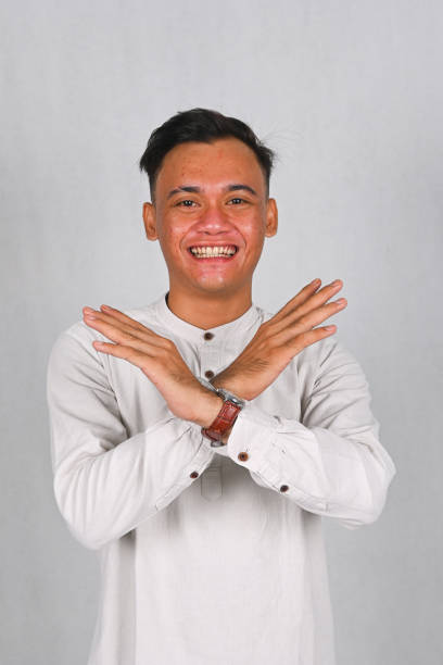 istock Asian young man excited and pointing up 2077252924