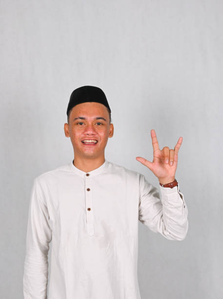 istock Asian young man excited and pointing up 2077258640