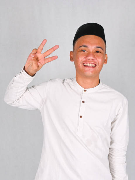 istock Asian young man excited and pointing up 2077272904