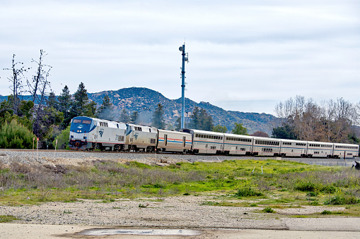 Railcars on tracks along California Route 99 near Bakersfield, California, USA