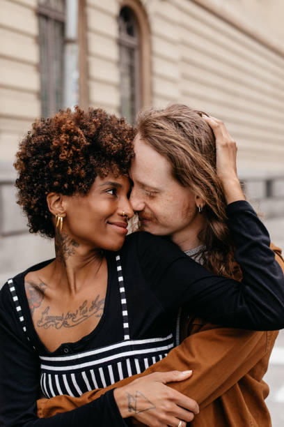 istock Intimate embrace on a city sidewalk, a moment of affection 2077281979