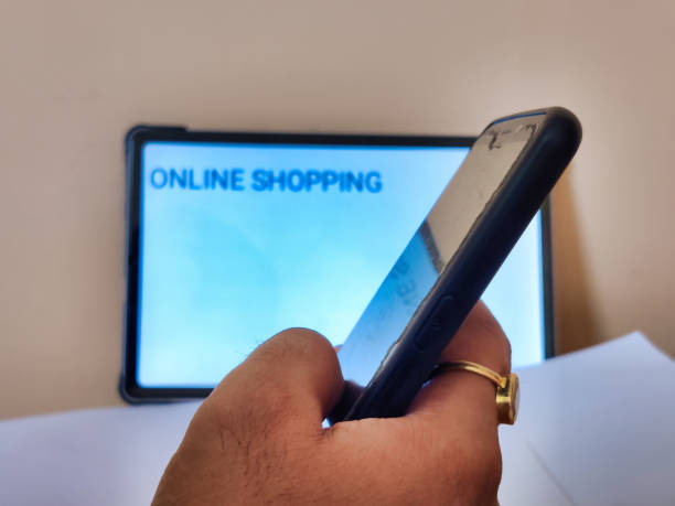 istock Person working on a cellphone doing ONLINE SHOPPING 2077296321