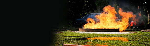 istock Firefighter Rescue training in fire fighting extinguisher. Firefighter fighting with flame using fire hose chemical water foam spray engine. Fireman wear hard hat, safety suit uniform for protection 2077314317