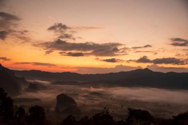istock Scenic view dramatic beautiful sunset sky. Natural Sunset Sunrise on meadow silhouette shadow dark land. Vibrant dramatic sky on sunset, dawn, sunrise in Countryside. Landscape Colorful Sky At Sunset 2077315347