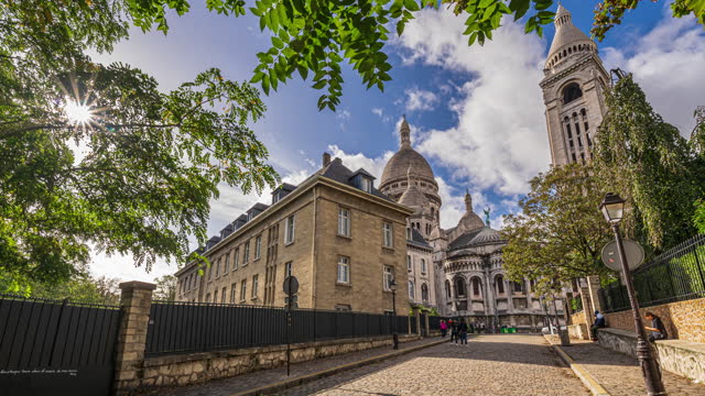4K Footage Time lapse of Crowd of People tourist walking and sightseeing attraction Basilica of the Sacred Heart at Montmartre a large hill in Paris's northern in summer, France, Europe,