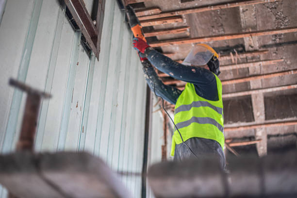 istock Renovation concept, construction worker demolishing ceiling in apartment 2077363810