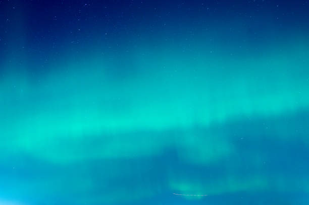 istock Green Aurora borealis on night sky 2077365367