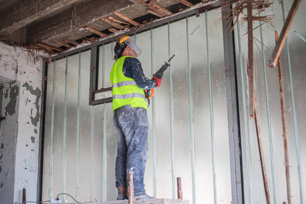 istock Renovation concept, construction worker demolishing ceiling in apartment 2077365387