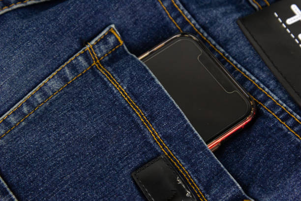 istock A blue jeans pocket with mobile phone in red 2077376970