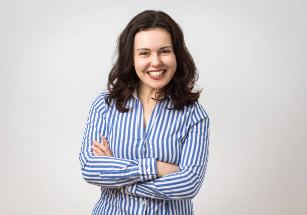 istock Confident young woman with arms crossed 2077411925