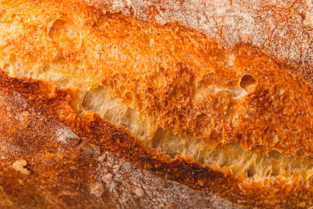 istock Ruddy crust of bread as an abstract background. Texture 2077451881