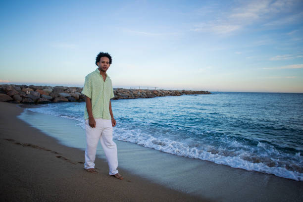 istock Portrait of young man on the beach 2077481018