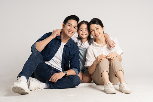 Asian family portrait posing on white background