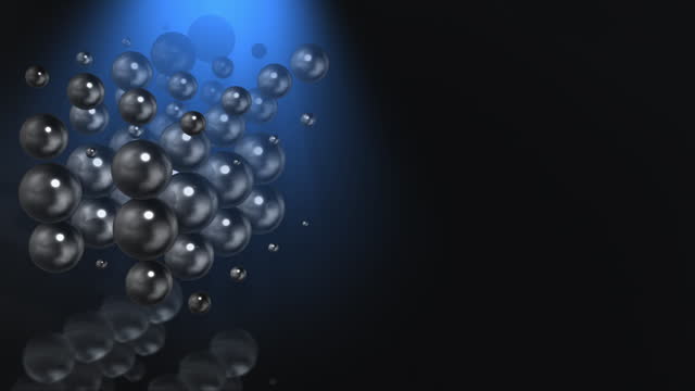 Abstract 3D animation loop of reflective spheres, with copy space.