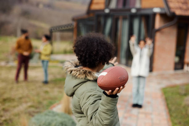 Playing with rugby ball in the backyard!
