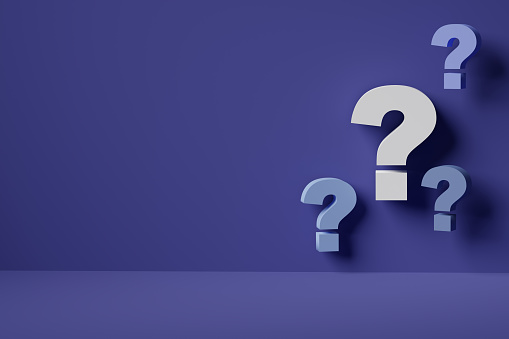 Front view of a question mark with copy space on a bluebackground