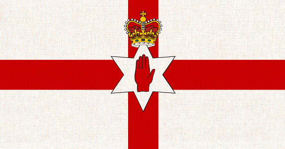 Flag of Northern Ireland. Irish flag on fabric surface. Northern Irish national flag on textured background. Republic of Northern Ireland. European country. State symbol of Northern Ireland