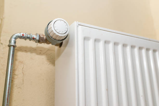 istock Old white radiator thermostat with copy space,closeup,selective focus,yellow background. 2077579250