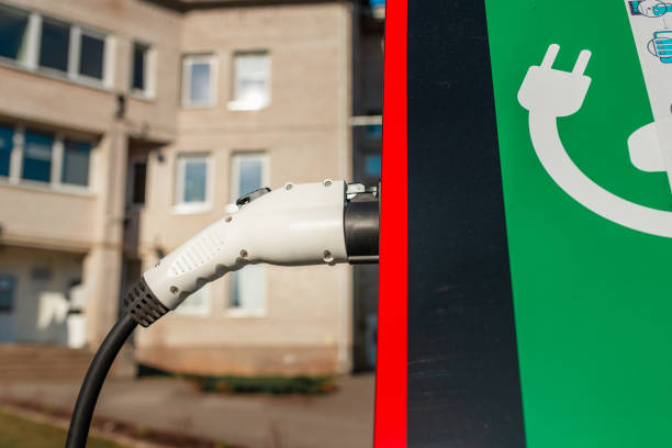 close up power cord for electric car. green station.power supply for electric car battery charging.selective focus.closeup. - 11207 ストックフォトと画像