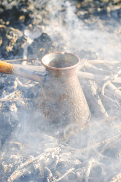 istock Boiling coffee in turkish cezva on campfire coals. 2077609242