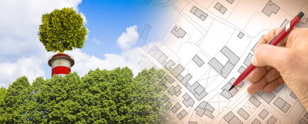 istock Green industrial conversion in our cities - Zero CO2 emissions concept with a tree on top of a chimney and imaginary city map 2077612930