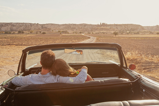 car rental, romantic luxury travel for couple in vintage cabriolet vehicle, homeymoon