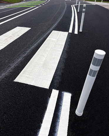 Confusing traffic flow with ballasts and zebra crossing.