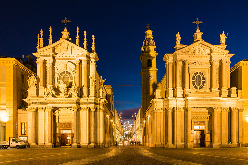 The twin churches of Santa Cristina and San Carlo Borromeo in Piazza San Carlo at night in Turin, Italy