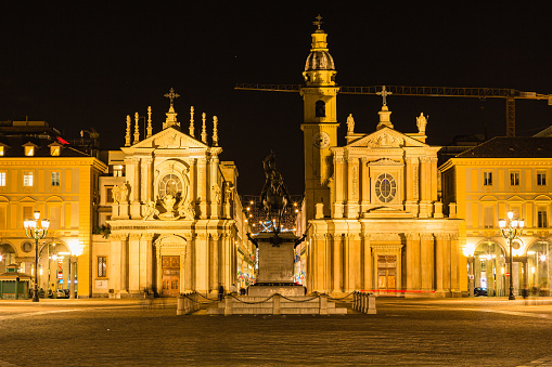 The twin churches of Santa Cristina and San Carlo Borromeo in Piazza San Carlo at night in Turin, Italy