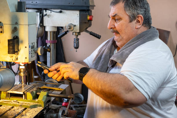 istock Turkish man working on his metal lathe machine 2077652118