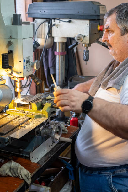 istock Turkish man working on his metal lathe machine 2077653181