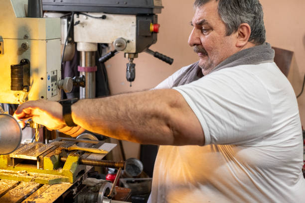 istock Turkish man working on his metal lathe machine 2077656361